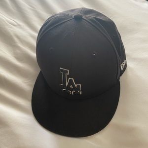 New Era Black SnapBack Dodger hat.